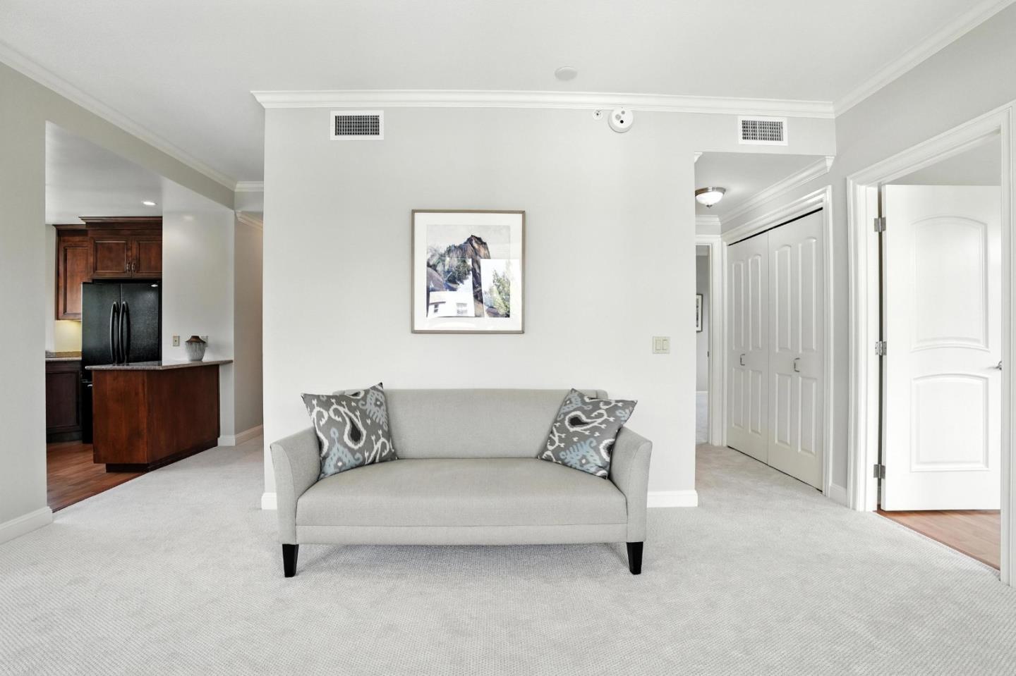 10 Crystal Springs Road, Unit 2414 San Mateo, CA 94402 - Photo 15 of 33 a living room with furniture and a lamp