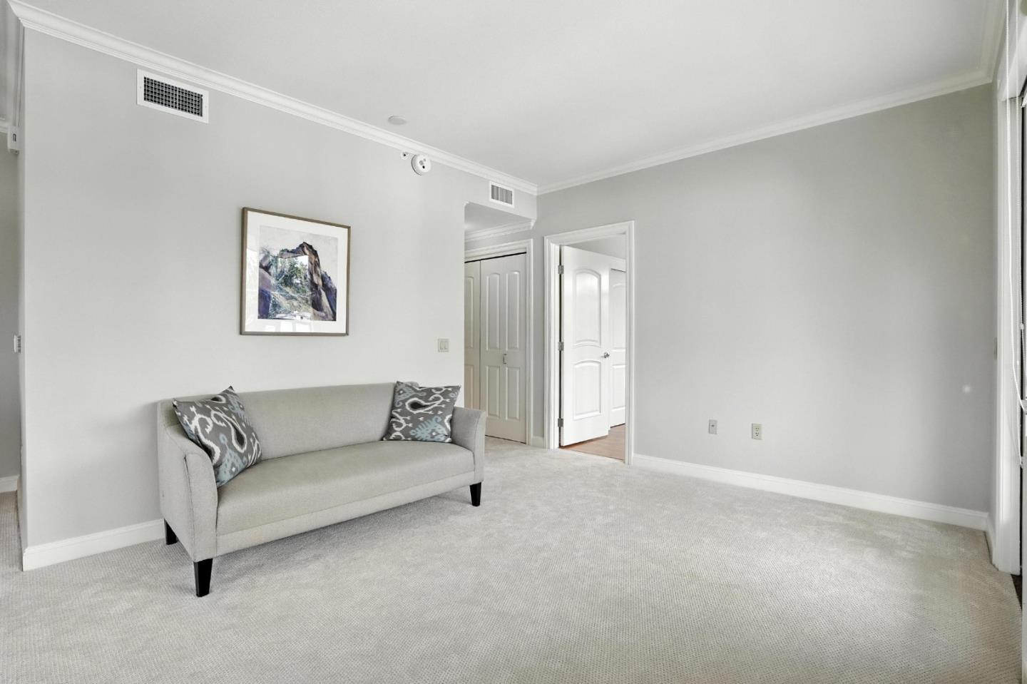10 Crystal Springs Road, Unit 2414 San Mateo, CA 94402 - Photo 16 of 33 a living room with furniture and a white wall next to a window