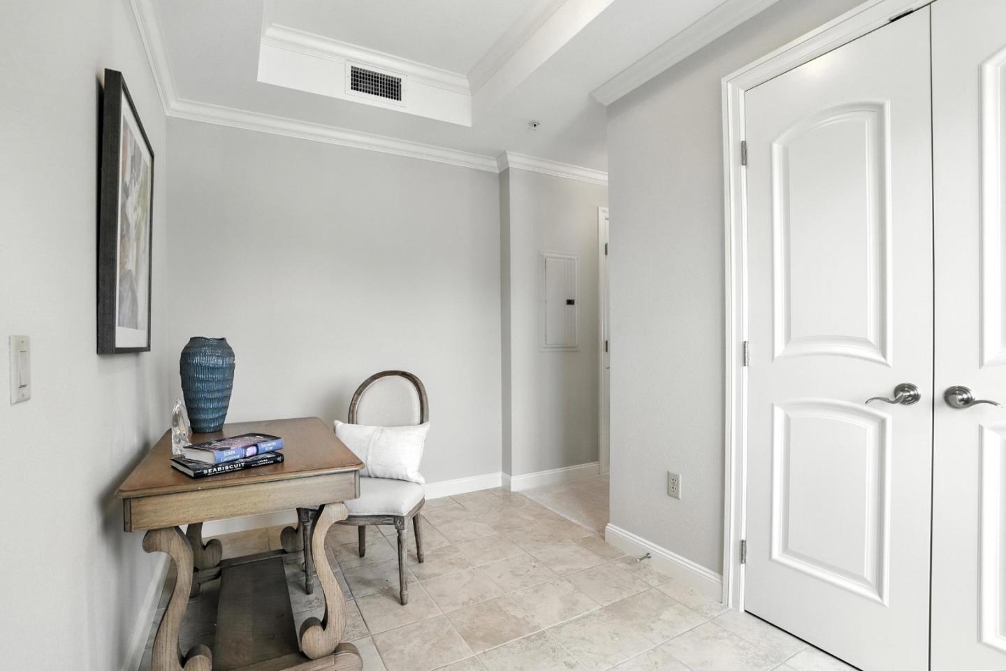 10 Crystal Springs Road, Unit 2414 San Mateo, CA 94402 - Photo 4 of 33 a room with a table and gym equipment