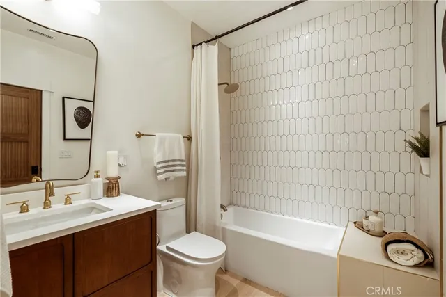 a bedroom with a bed dresser and a window