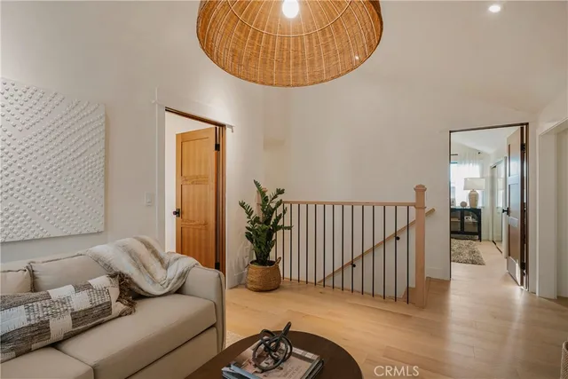 a bedroom with a bed and a large mirror