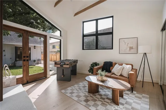 a bed room with a bed and a potted plant