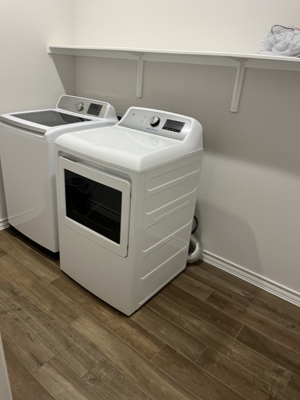 11715 Caithness Way Austin, TX 78653 - Photo 15 of 40 Laundry room featuring dark wood-type flooring and independent washer and dryer