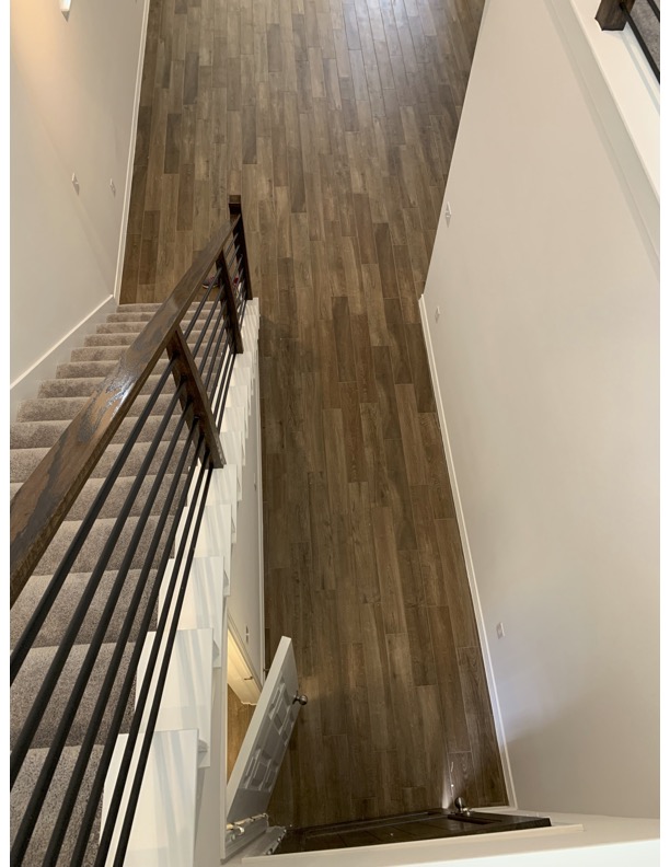 11715 Caithness Way Austin, TX 78653 - Photo 17 of 40 Staircase with wood finished tile floors