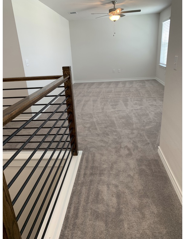 11715 Caithness Way Austin, TX 78653 - Photo 19 of 40 Stairs with carpet floors and ceiling fan