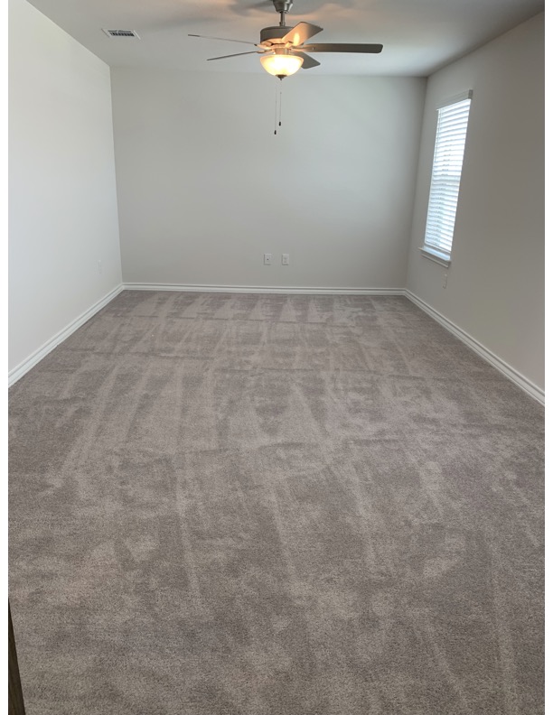 11715 Caithness Way Austin, TX 78653 - Photo 20 of 40 Upstairs flex/game/study/office room with a ceiling fan and carpet floors