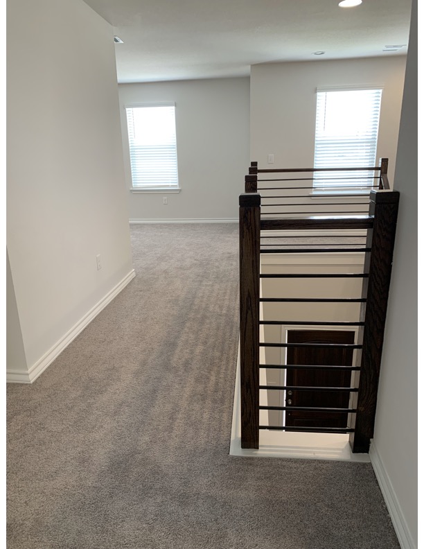 11715 Caithness Way Austin, TX 78653 - Photo 23 of 40 Upstairs hallway featuring carpet