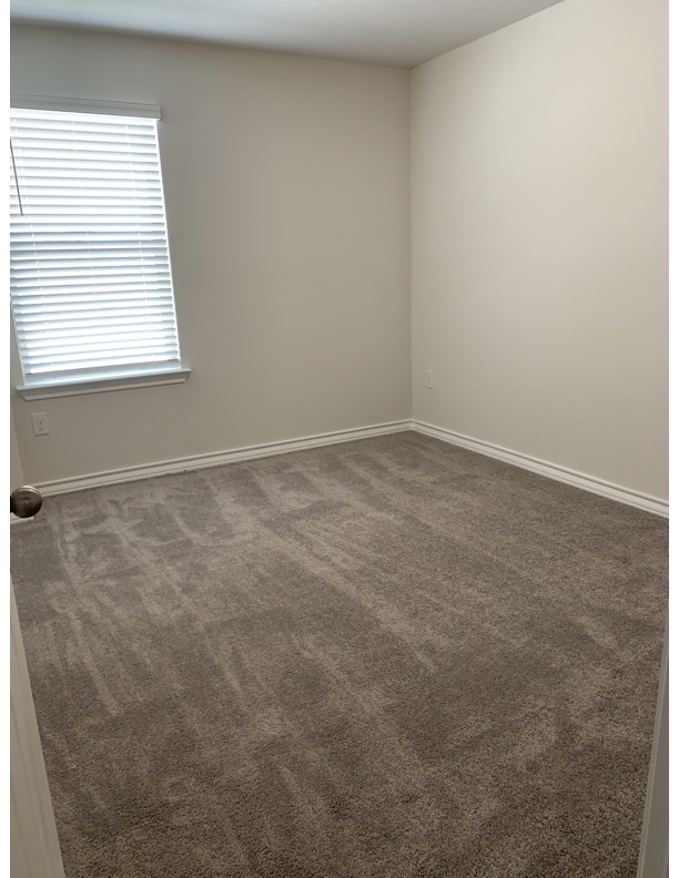11715 Caithness Way Austin, TX 78653 - Photo 27 of 40 4th bedroom featuring dark colored carpet and baseboards