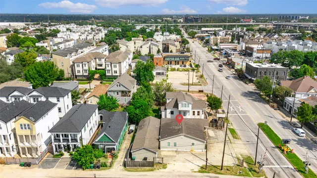 an aerial view of residential building with parking