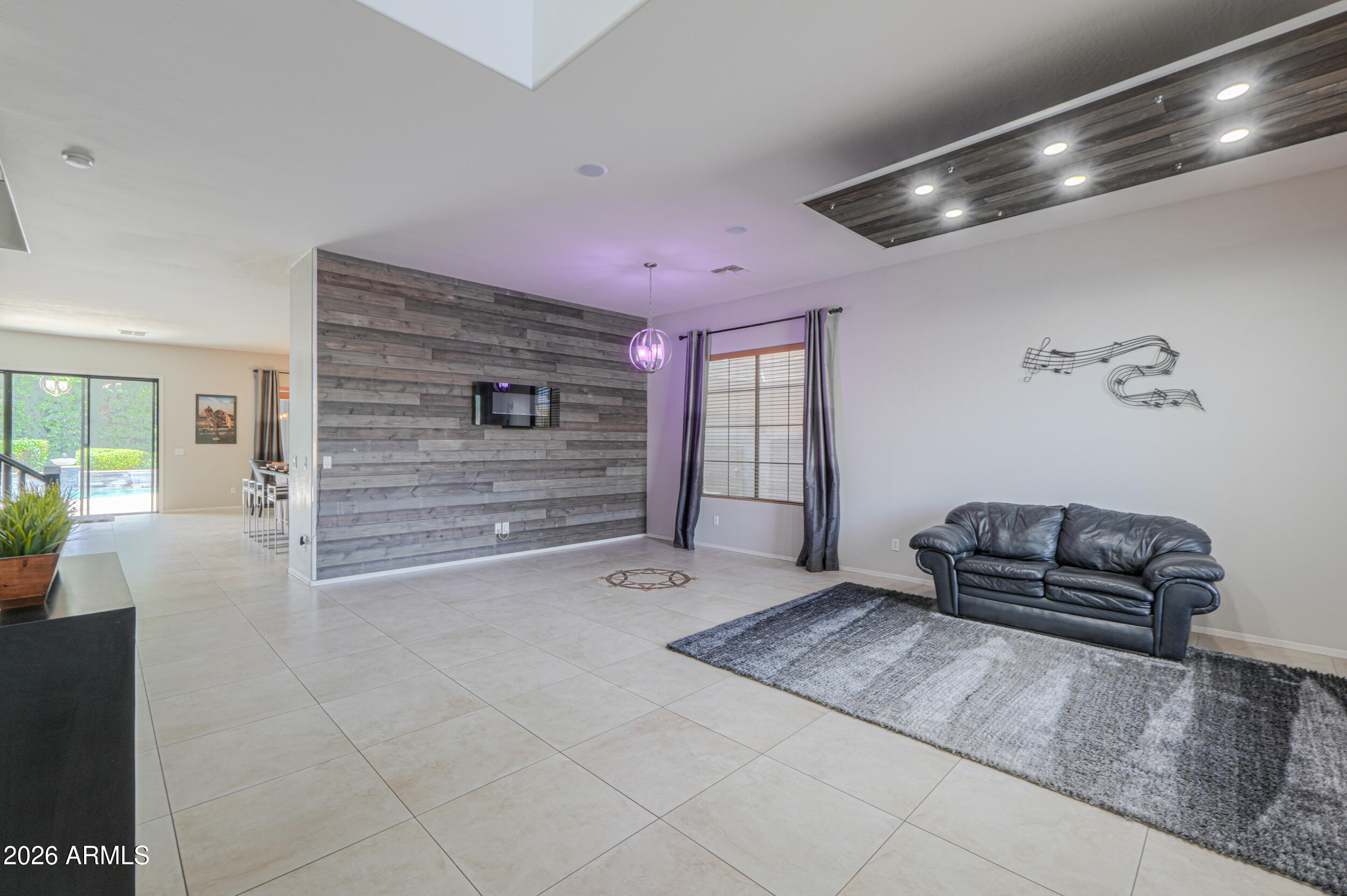 45247 West Jack Rabbit Trail Maricopa, AZ 85139 - Photo 6 of 75 a bedroom with a bed and a couch