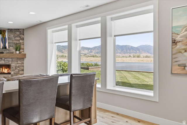 21 Pier Place Tooele, UT 84074 - Photo 59 of 112 Bright interior with three large windows showcasing water and mountain scenery
