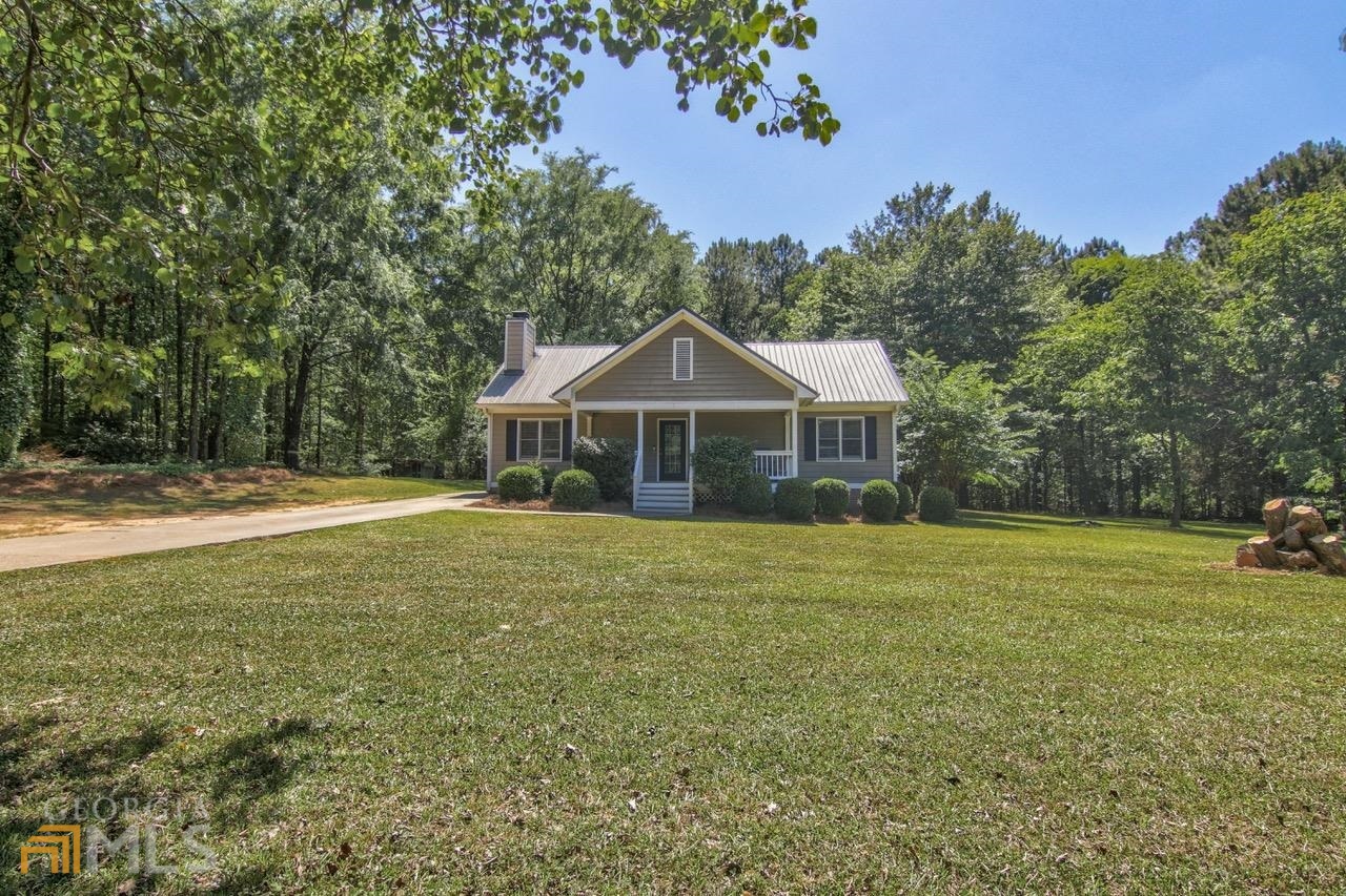 2111 Parks Mill Road Buckhead, GA 30625 - Photo 1 of 1 a front view of a house with garden