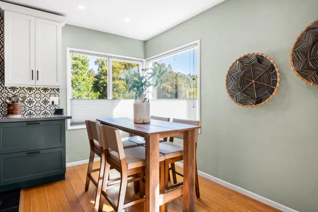 a dining room with furniture and window