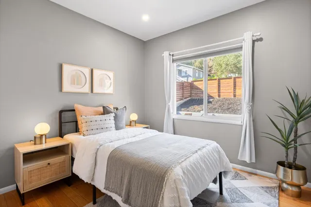 a bedroom with a bed and a window