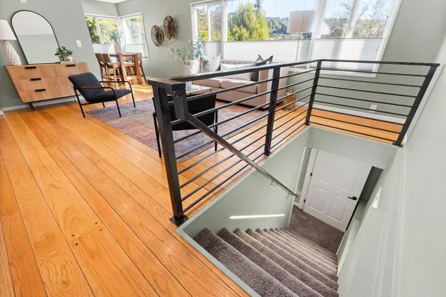a view of a living room and a wooden floor