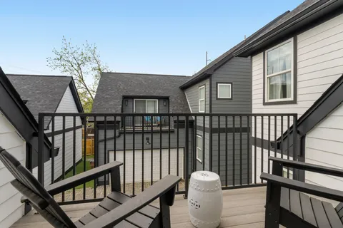 a view of a balcony with furniture