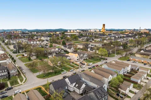 an aerial view of residential building with parking