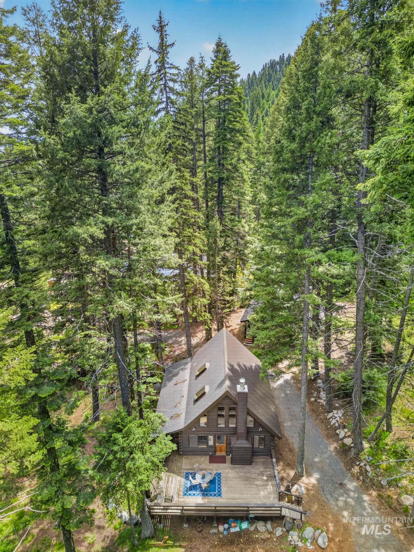 2339 West Mountain Road Donnelly, ID 83615 - Photo 2 of 37 Cabin-style residence featuring a dark wood exterior and a multi-level deck