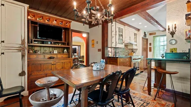 a dining room with furniture and window