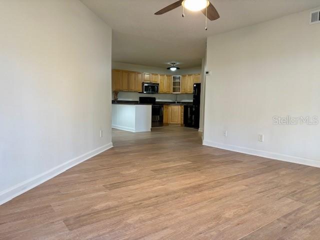 1550 South Belcher Road, Unit 211 Clearwater, FL 33764 - Photo 5 of 26 a view of kitchen with wooden floor