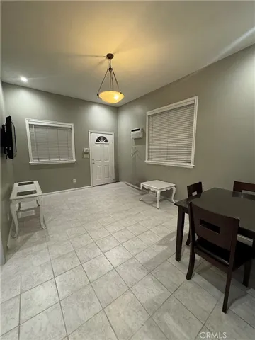 a bedroom with a bed a desk and chair