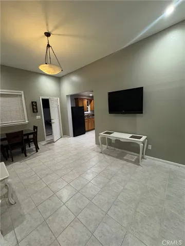 a bedroom with furniture and a flat screen tv