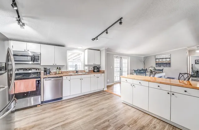 a large kitchen with a lot of counter space and appliances