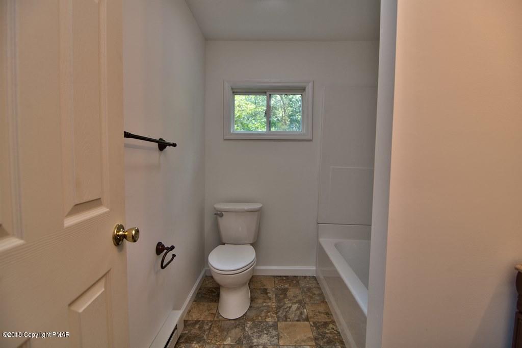 1103 Cameron Road Effort, PA 18330 - Photo 23 of 40 a white toilet sitting next to a small sink