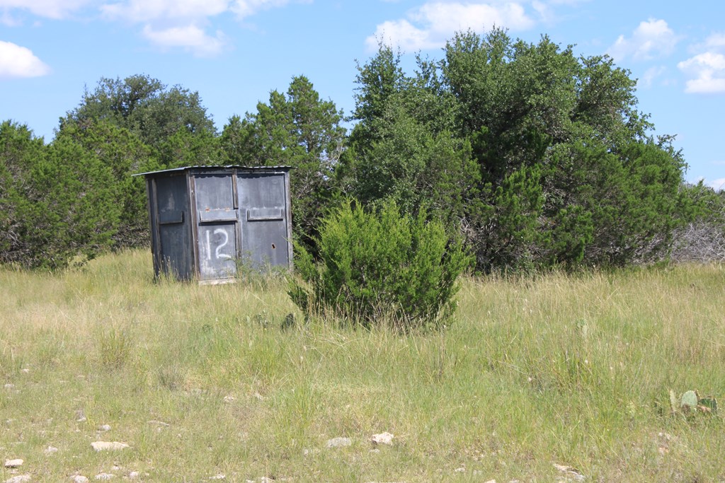 0 Dominion Road Rocksprings, TX 78880 - Photo 14 of 27 a backyard of a house with lots of green space and trees