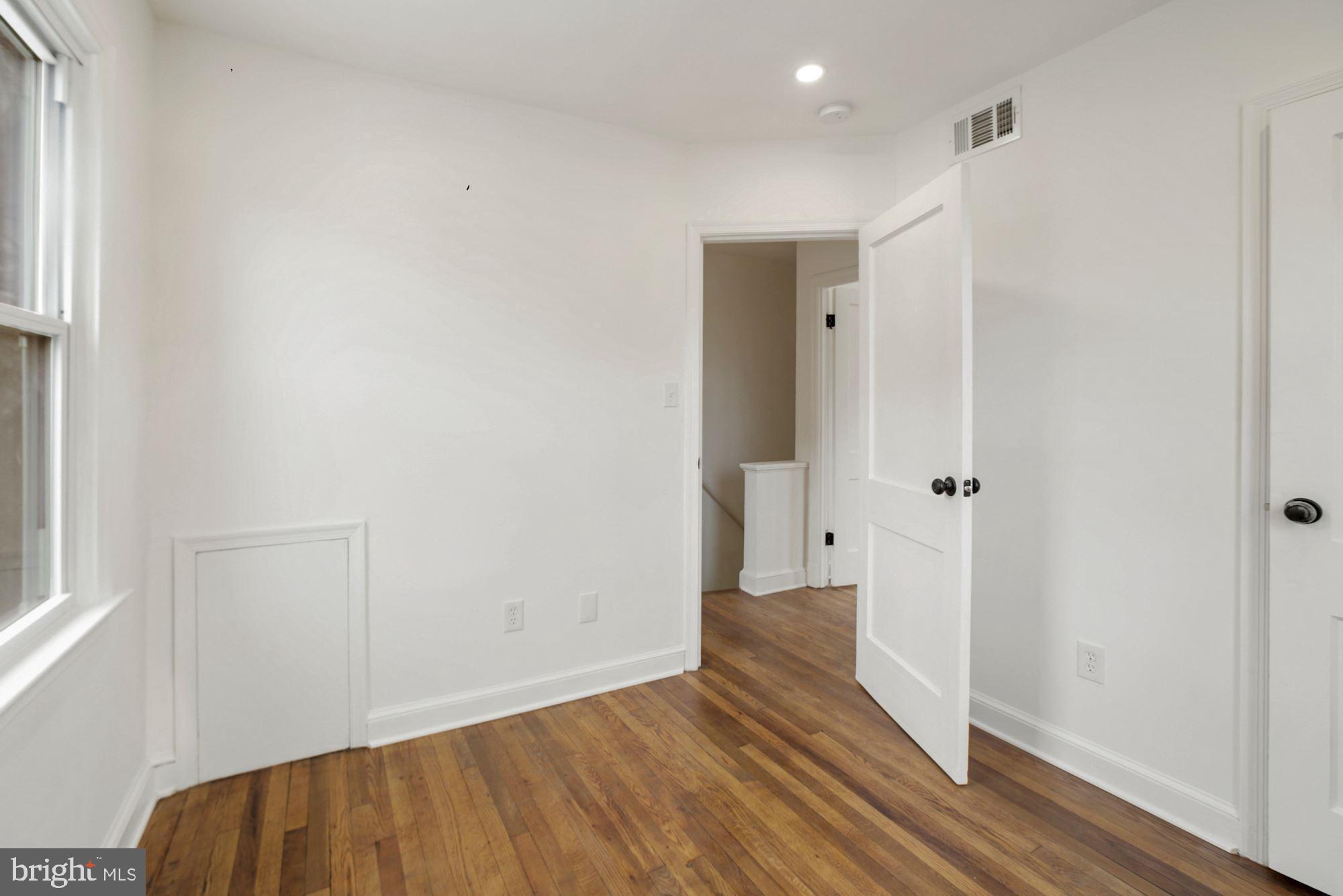 1530 Howard Road Southeast Washington, DC 20020 - Photo 16 of 32 a view of a hallway with wooden floor