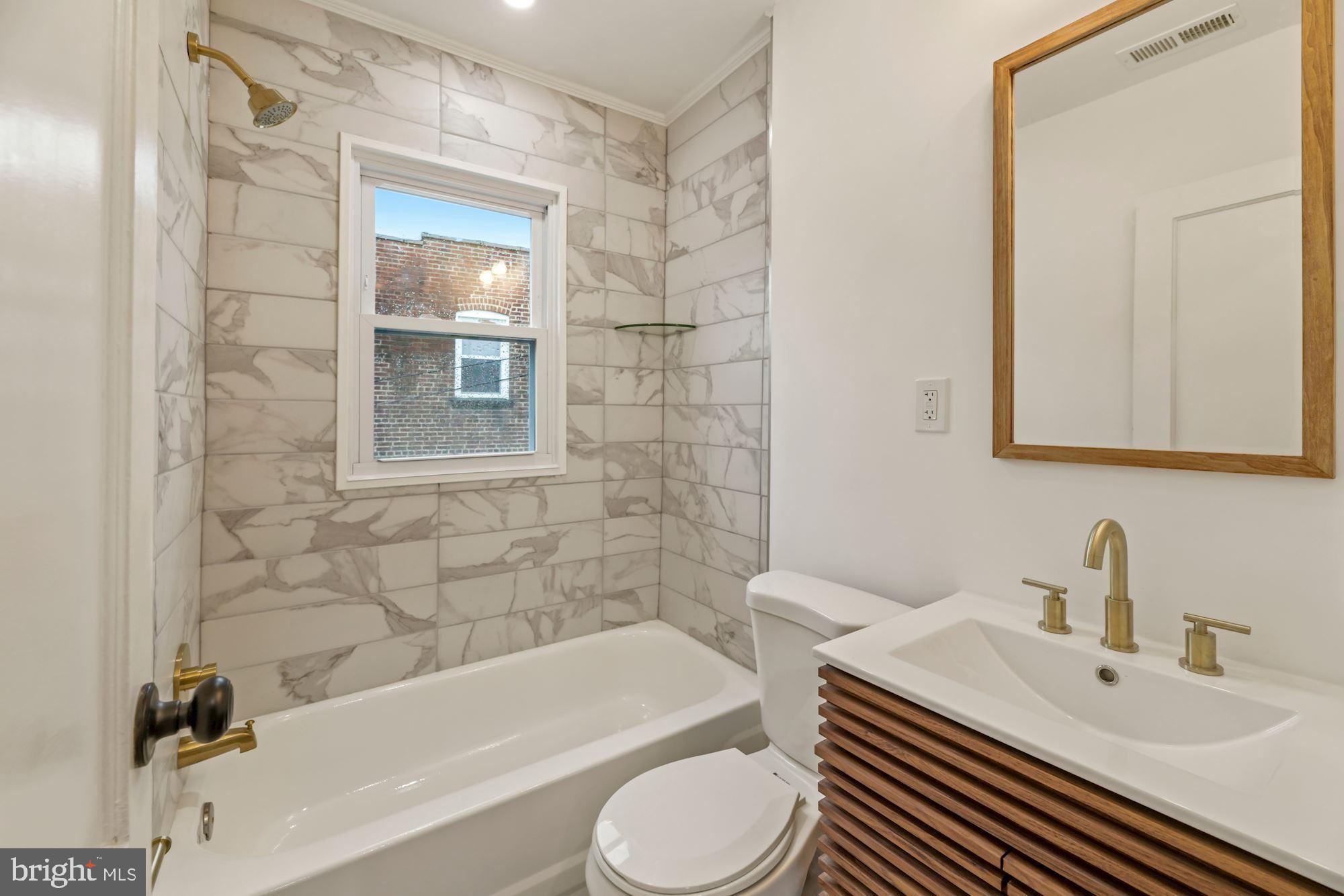 1530 Howard Road Southeast Washington, DC 20020 - Photo 18 of 32 a bathroom with a sink toilet and bathtub
