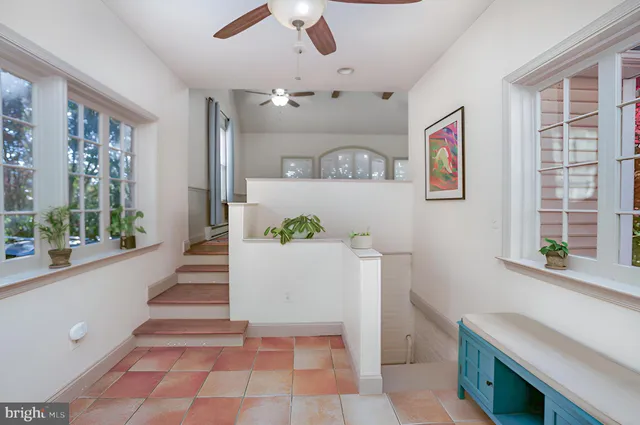 a view of a room with window and furniture