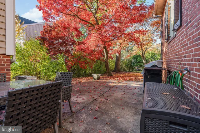 a view of a backyard with sitting area