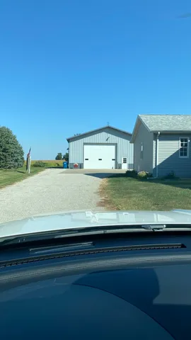 a view of a kitchen with a sink and a yard
