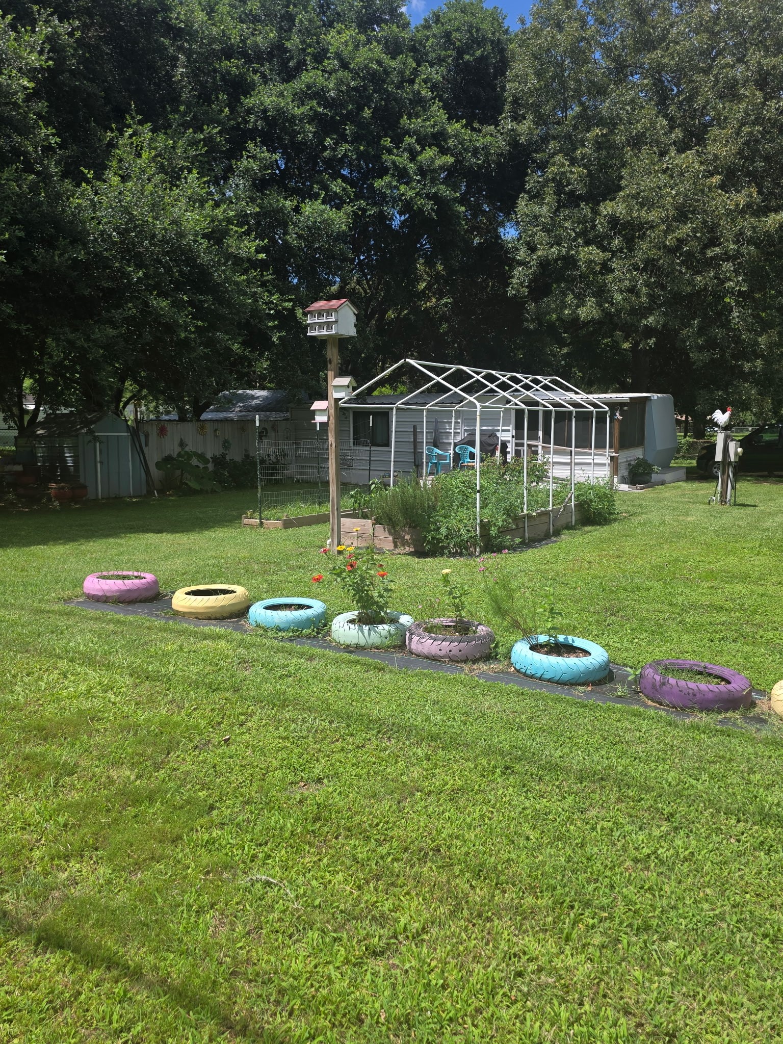 11 Pine Road Coldspring, TX 77331 - Photo 2 of 32 a front view of a house with porch and garden