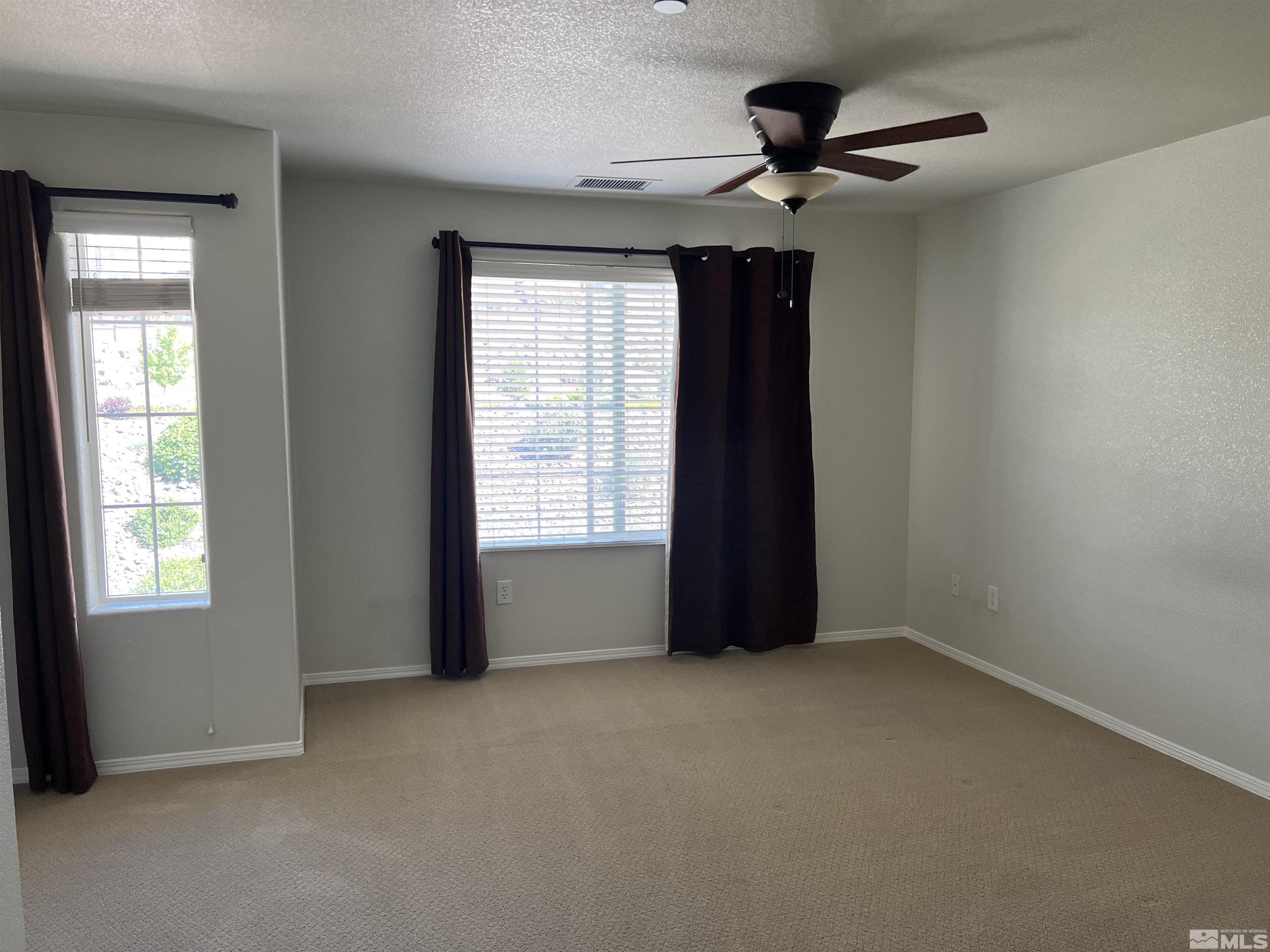 3078 Sterling Ridge Circle Sparks, NV 89431 - Photo 12 of 16 a view of an empty room with a window