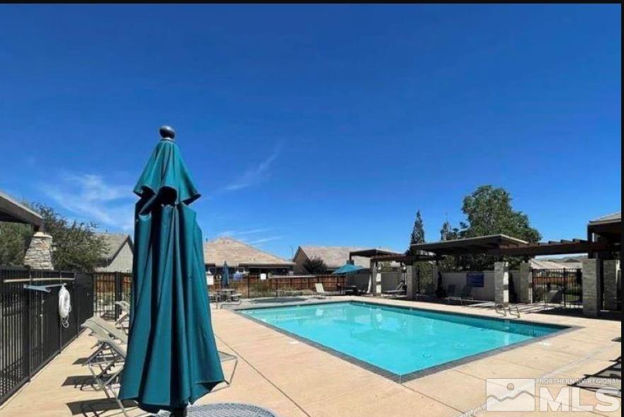 3078 Sterling Ridge Circle Sparks, NV 89431 - Photo 16 of 16 a view of a terrace with a garden