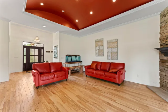 a living room with furniture fireplace and flat screen tv