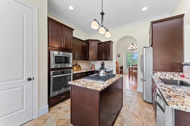 a kitchen with a table and chairs in it