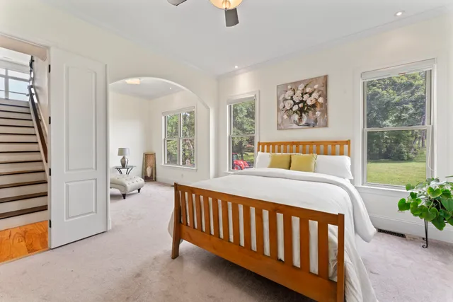 a bathroom with a granite countertop sink a toilet and a mirror