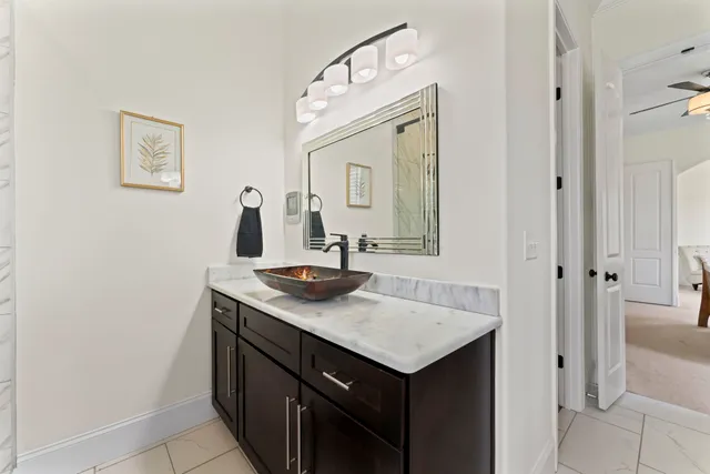 a bedroom with a bed and a table in it