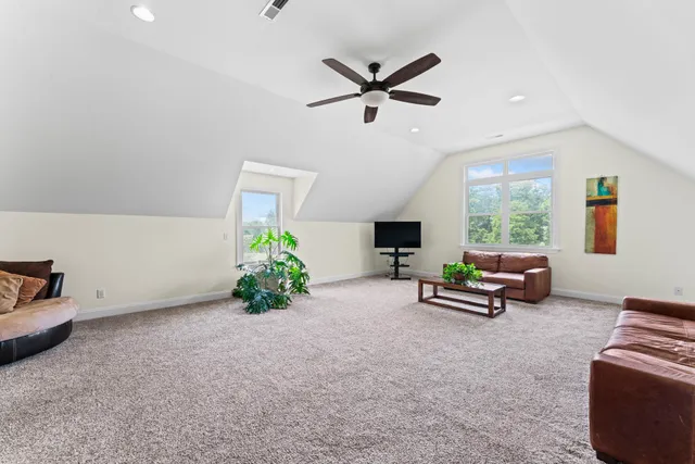 a bedroom with a bed and a desk