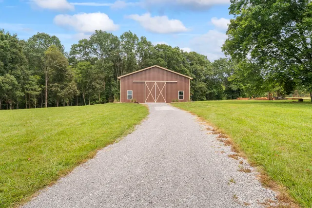 a view of a golf course with a lake view