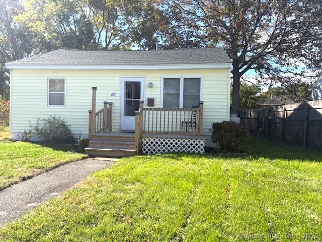 a view of a house with a yard and a garden