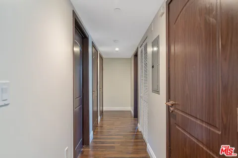a view of a hallway with washer and dryer