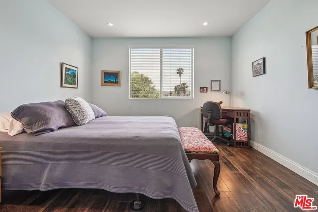 a bedroom with a bed and a table in it