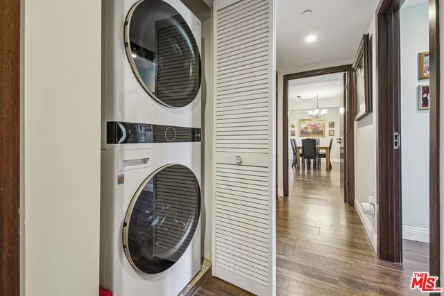a view of a hallway with washer and dryer