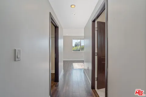 a view of room with mirror and bathroom