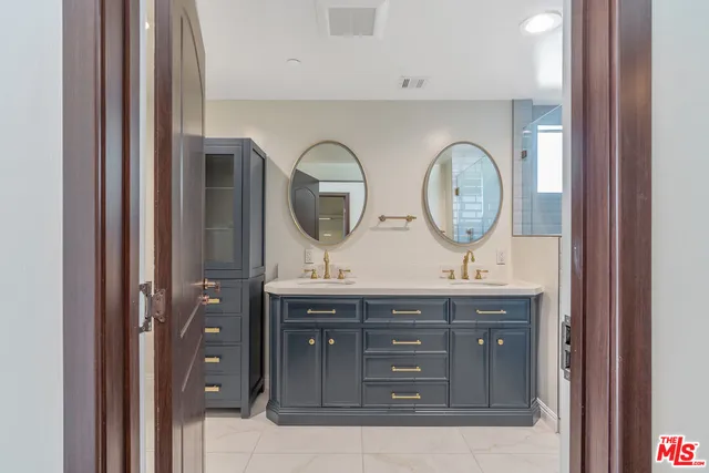 a bathroom with a sink and mirror