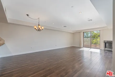 a view of a livingroom with wooden floor